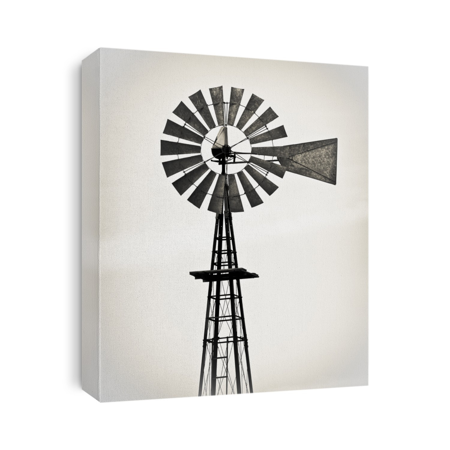 Vintage metal windmill against white background