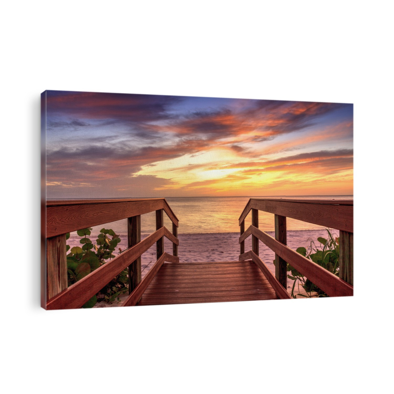 Boardwalk leading to a Sunset over North Gulf Shore Beach along the coastline of Naples, Florida
