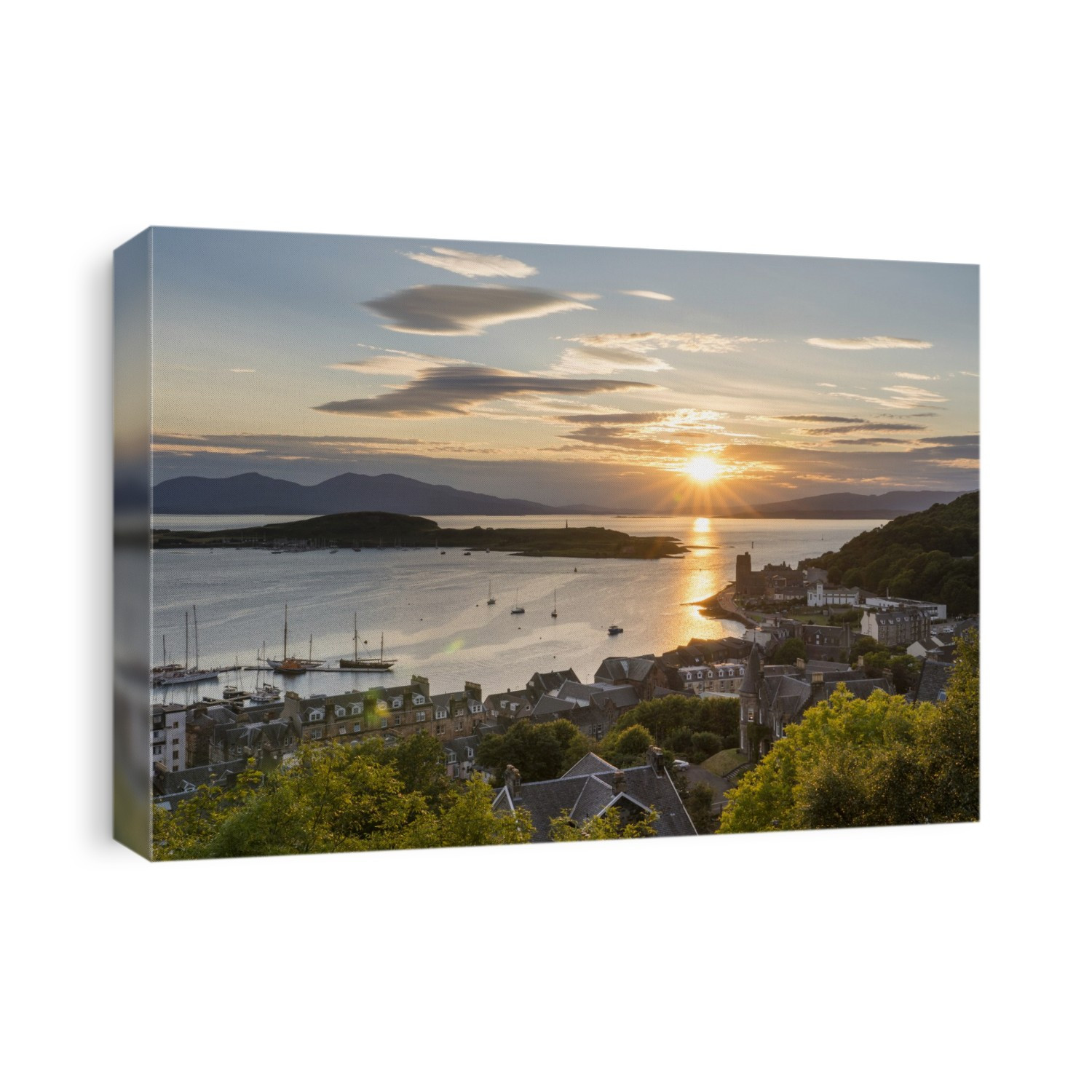 The sun sets over the harbour waters of Oban, Scotland; Oban, Scotland