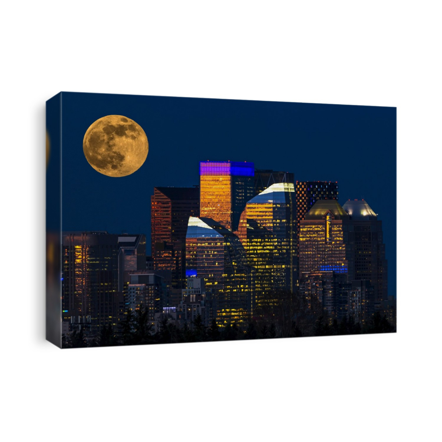Dramatic and colourfully lit buildings reflecting the sun set with a warm glowing full moon rising in sky; Calgary, Alberta, Canada