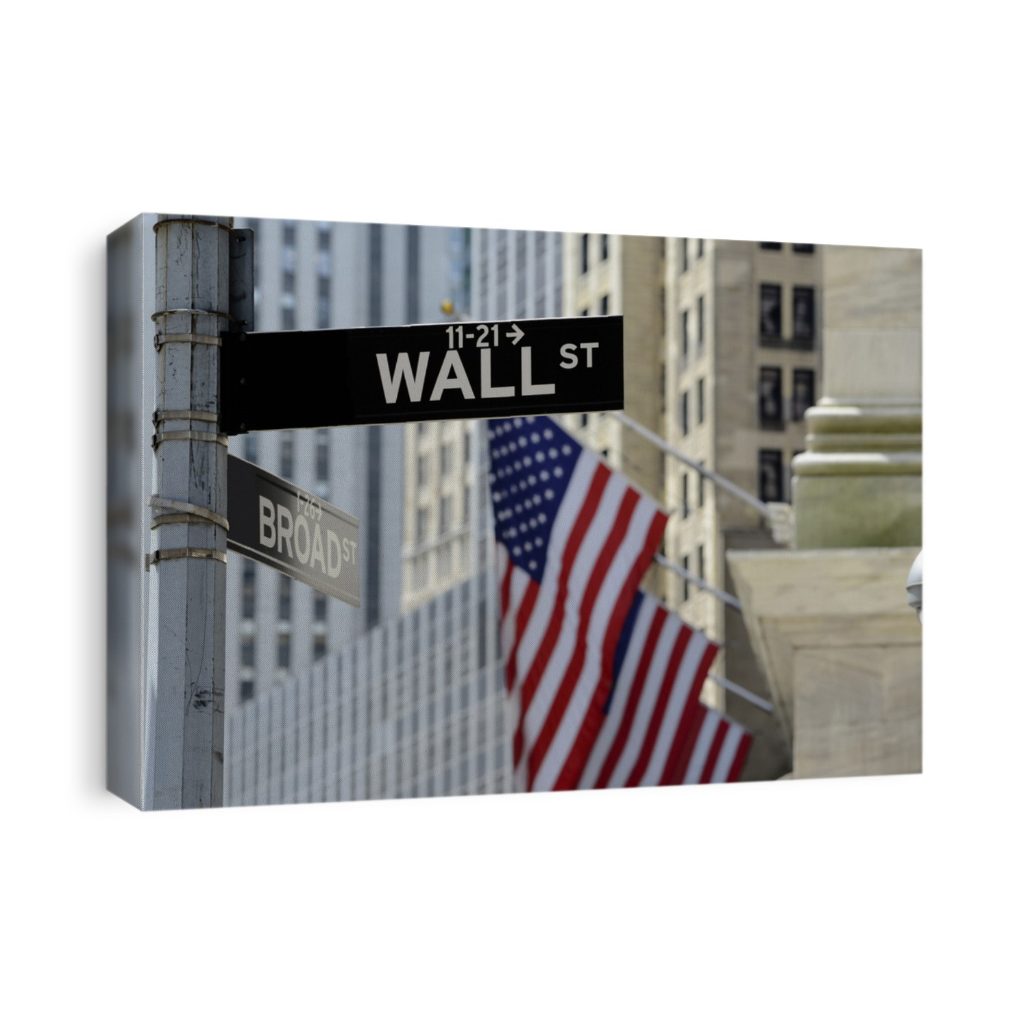 Wall street sign with focus on sign, blurred American flag background
