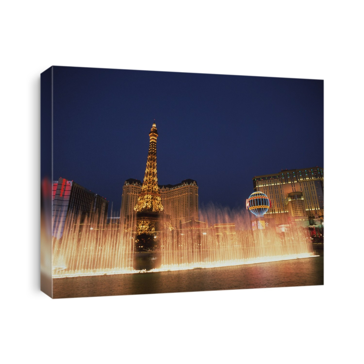 Las Vegas casino. Fountains outside the Paris Casino in Las Vegas, Nevada, USA. A model of the Eiffel Tower can also be seen.