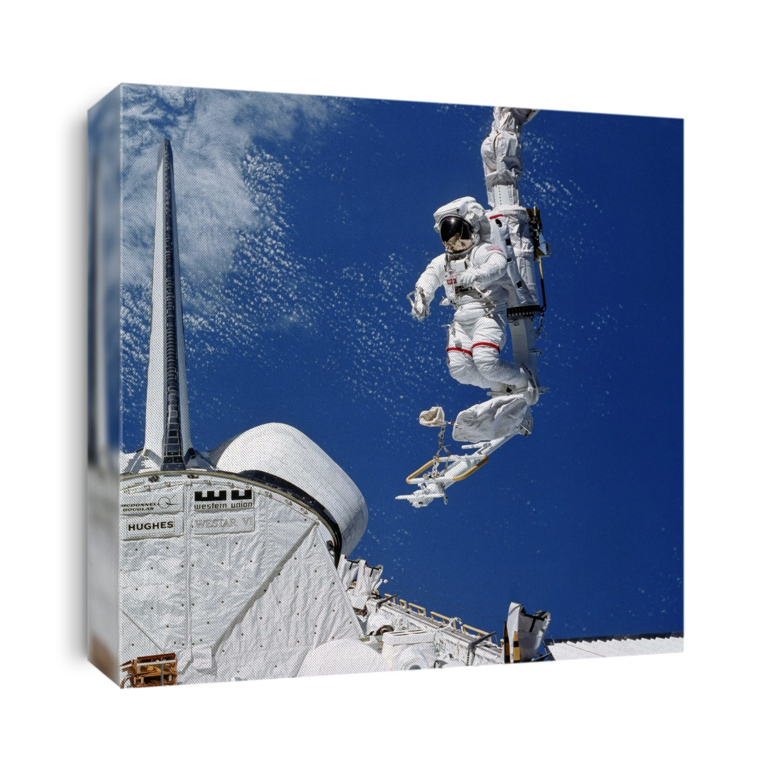Astronaut Bruce McCandless in MMU (manned maneuvring unit) practises attachment to side of the shuttle.