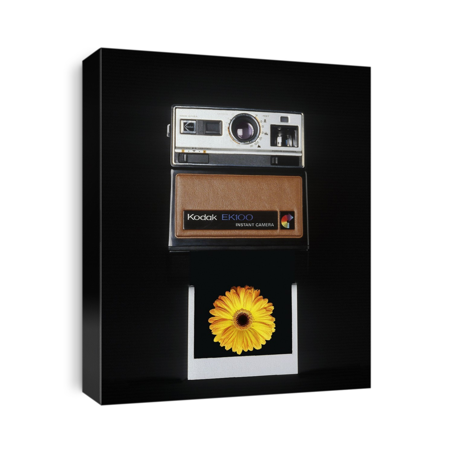 Instant camera. Developed film emerging from an instant camera. This is the Kodak EK100 which was manufactured by Kodak between 1977 and 1986.
