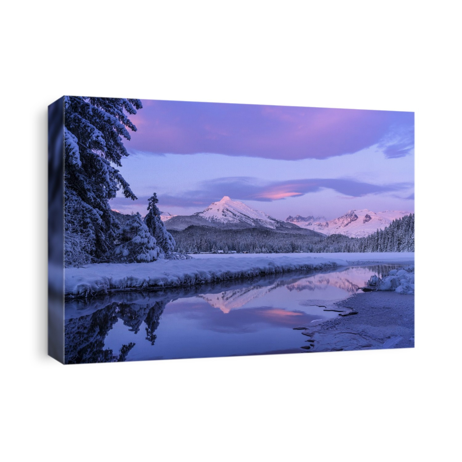 Alpenglow colours the snow-covered coastal range mountains, Mendenhall Glacier and Mendenhall towers are reflected in the open water along the edge of Auke Lake as the sun gets ready to set; Alaska, United States of America