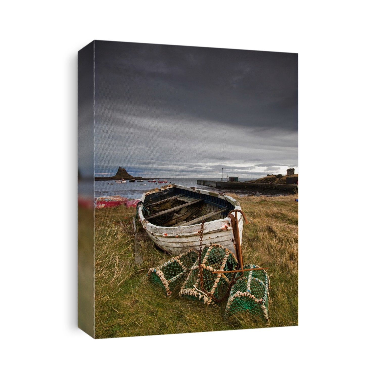 A Weathered Boat And Fishing Equipment Sitting On The Shore With Lindisfarne Castle In The Distance; Lindisfarne, Northumberland, England