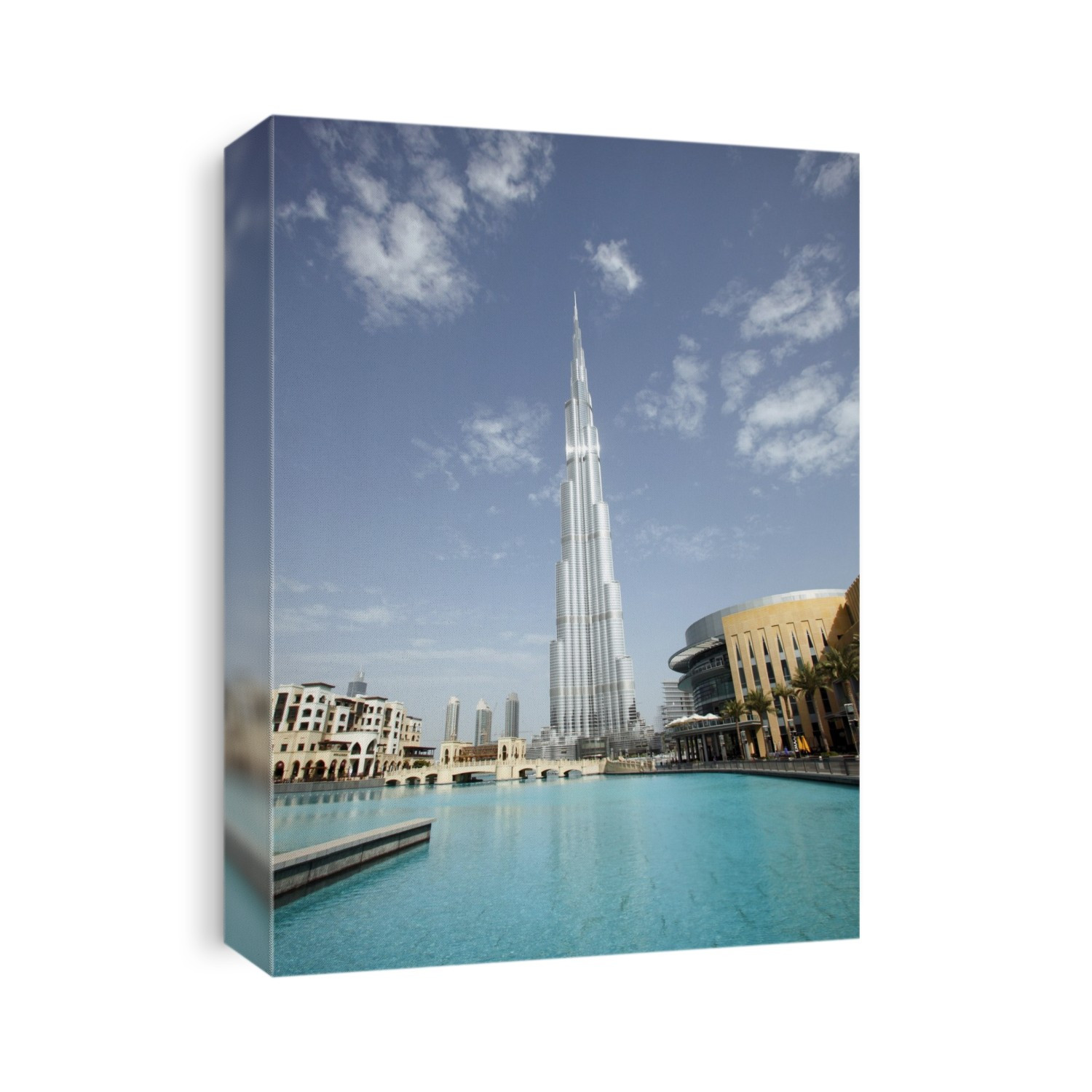 Burj Khalifa skyscraper, Dubai, United Arab Emirates. Constructed between 2004 and 2010, this skyscraper rises to a height of 830 metres. It has been the tallest building in the world since 2010. Located in the Downtown Dubai area, it has 163 floors and contains both residential and office space. The design is a series of spiralling setbacks around a buttressed core. The primary materials used were reinforced concrete, steel and glass. The surrounding area includes a large lake (foreground), parks and other buildings.
