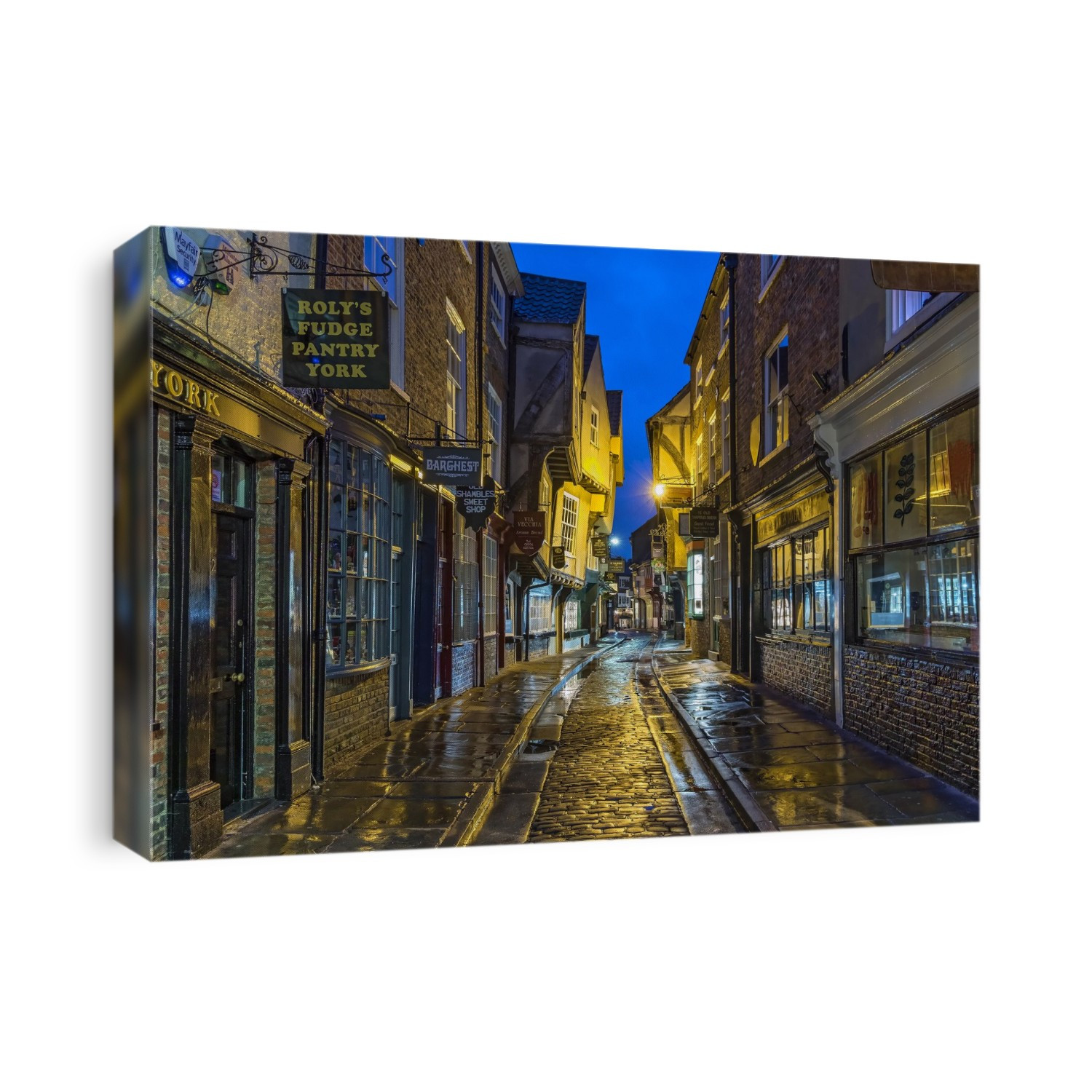 The historic medieval Shambles street at night in the city of York.