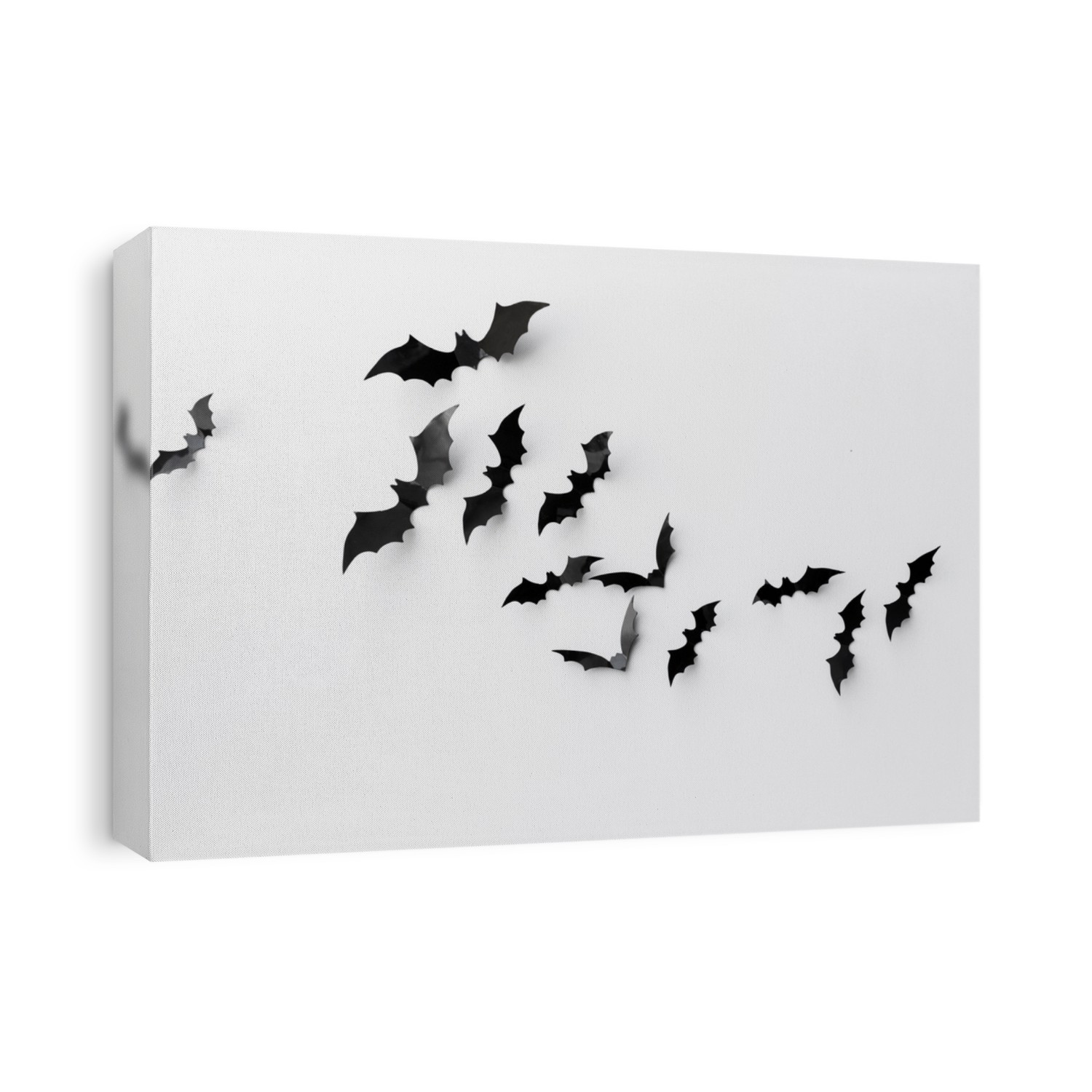 halloween and decoration concept - black paper bats flying over white background