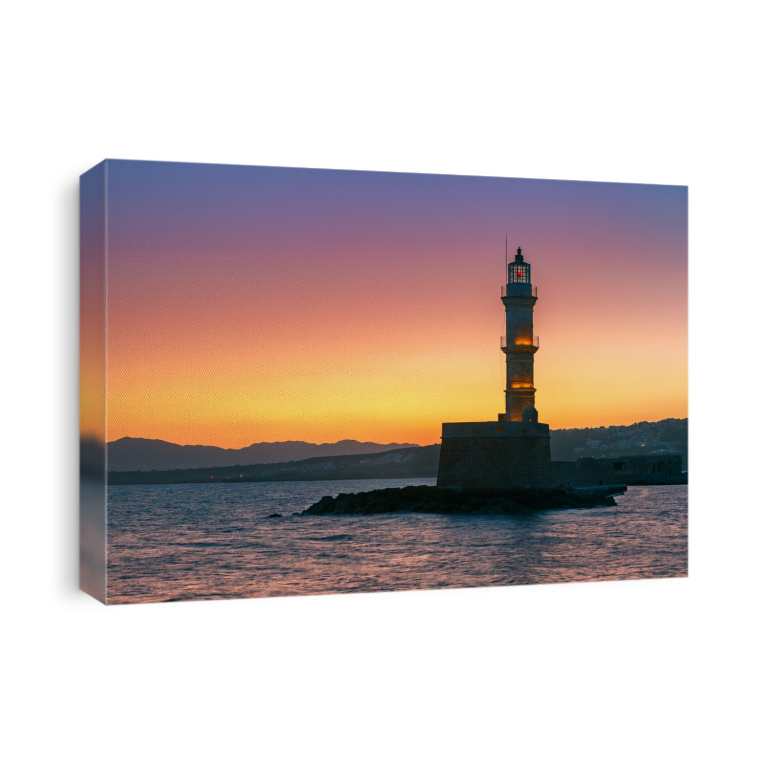 Lighthouse in old harbour of Chania at sunrise, Crete, Greece