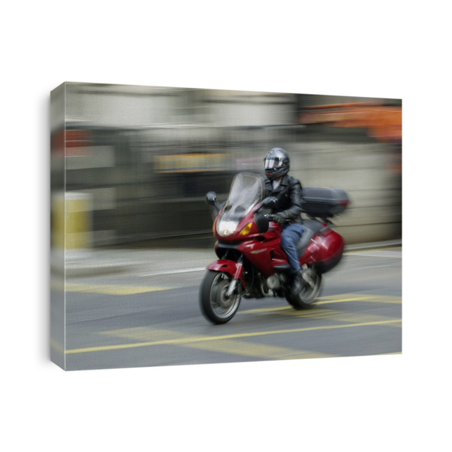 MODEL RELEASED. Motorcycle. Man riding a motorcycle along a city road.