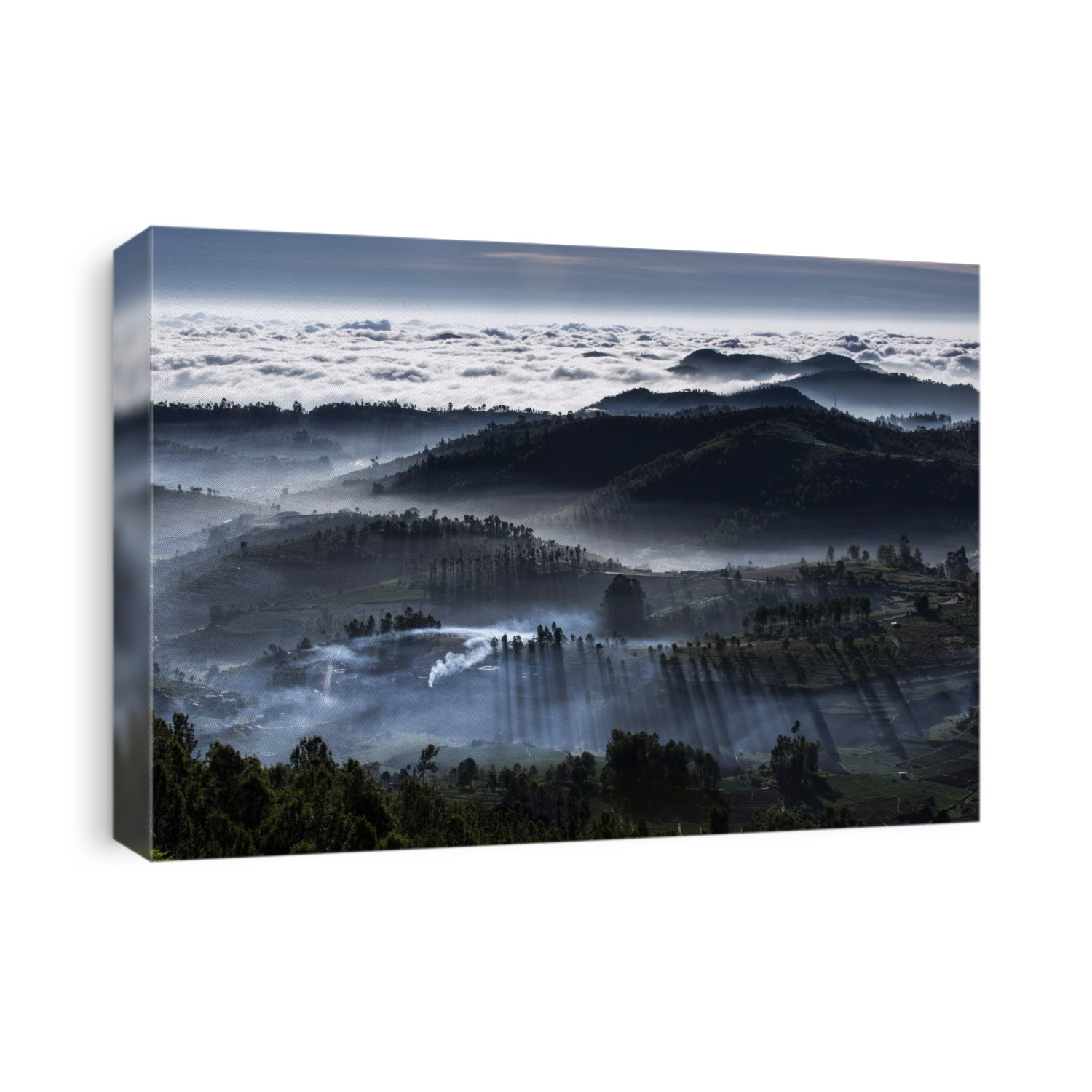 Mist-shrouded mountain valleys. Aerial view over mountains and valleys shrouded in mist and clouds. Photographed in India.