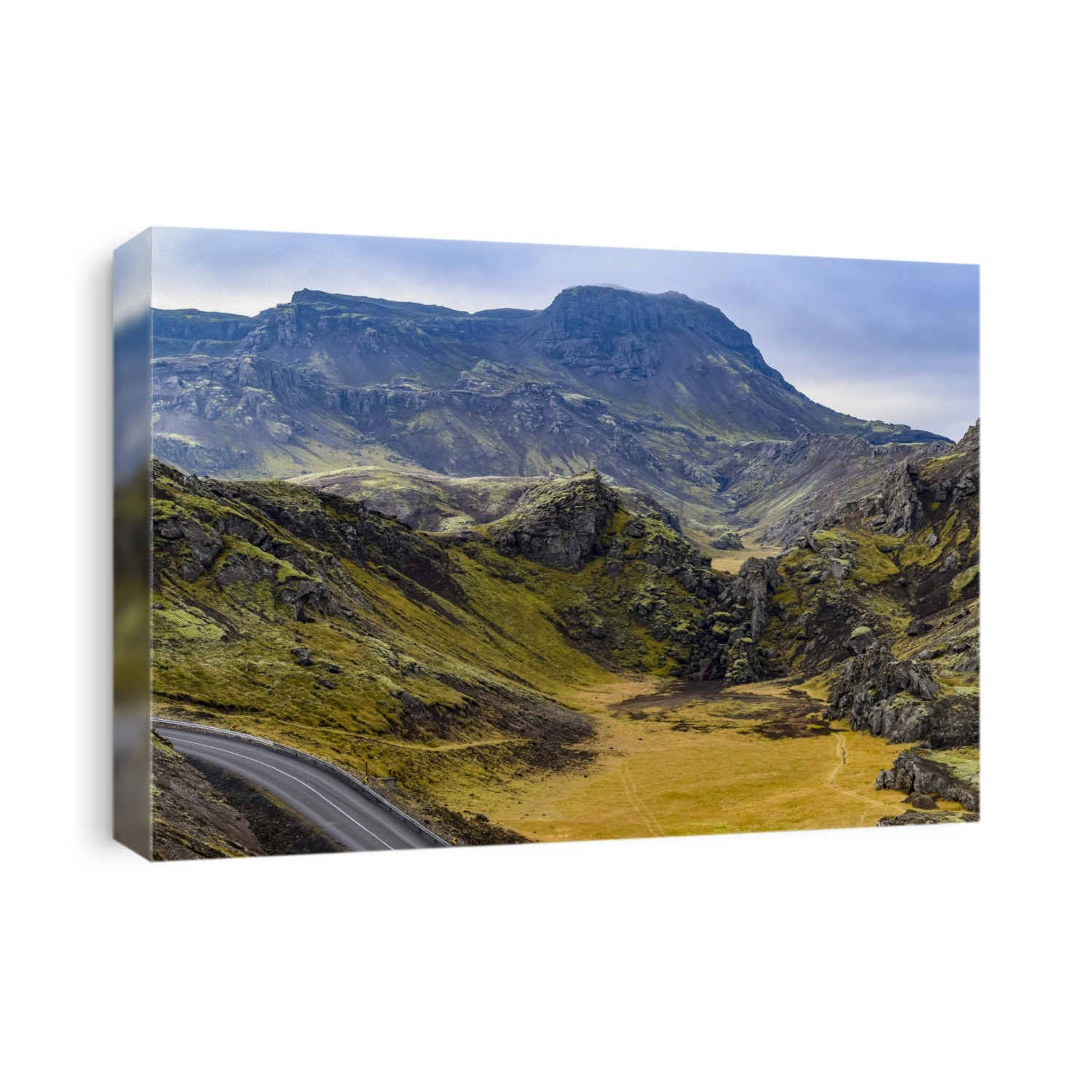 A road winds through a rugged landscape in Southern Iceland; Grimsnes- og Grafningshreppur, Southern Region, Iceland