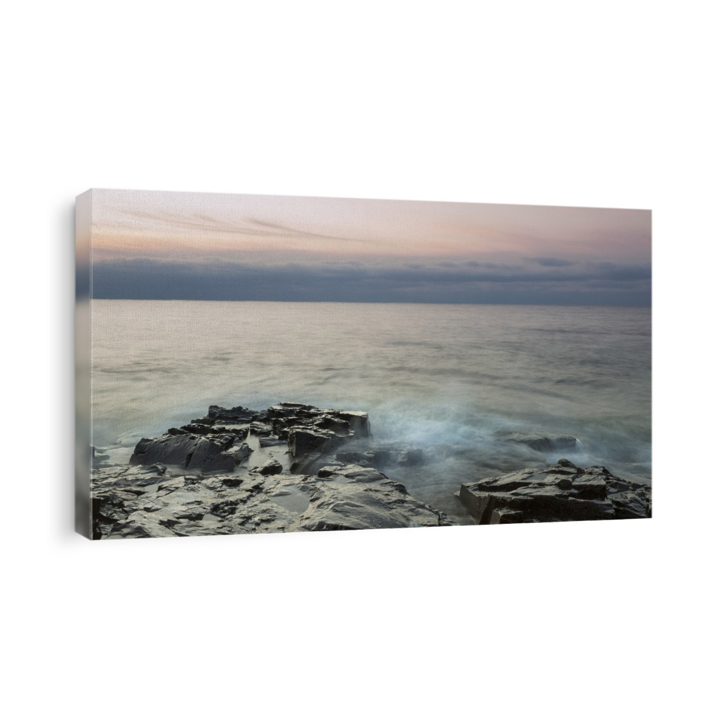 Sunset sky and storm clouds over Lake Superior with the surf rolling into a rocky shore; Grand Portage, Minnesota, United States of America