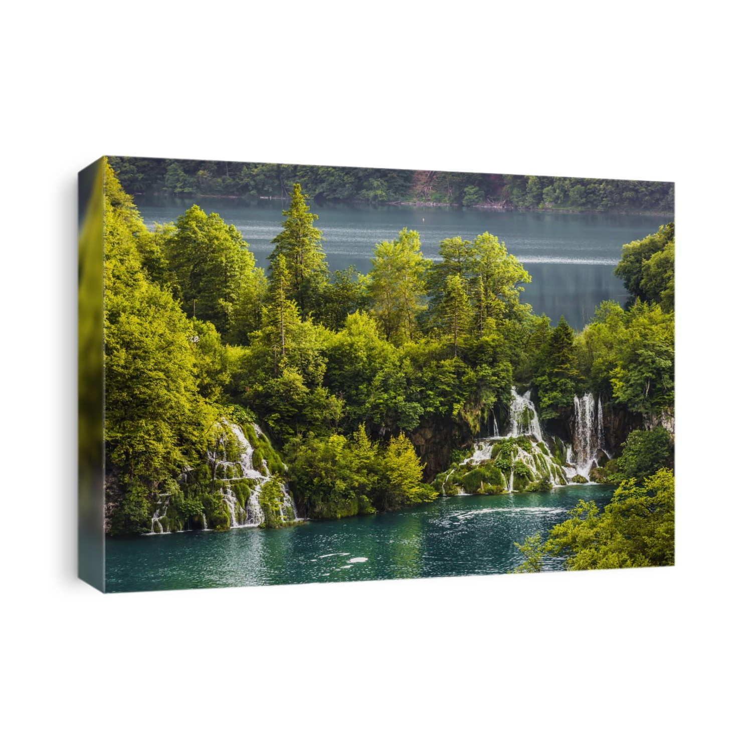 Waterfalls with turquoise water surrounded by trees at the Plitvice Lakes National Park in Lika-Senj county in Croatia