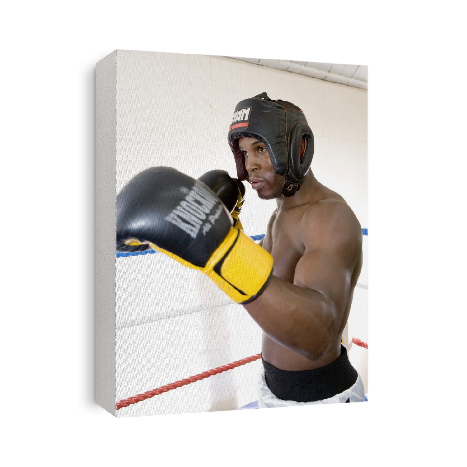 MODEL RELEASED. Boxer sparring with an unseen opponent. Boxing is a combat sport where two opponents of equal weight hit each other with gloved fists. Punches are only allowed to the head and body. Boxers practice for fights by sparring with each other in the boxing ring. During contests, boxers often aim for a knockout punch that causes the opponent to fall unconscious. Concussion or permanent brain damage can result as a consequence of a knockout punch. Boxers must wear protective equipment such as a gumshield, gloves and, in amateur boxing, head protection.