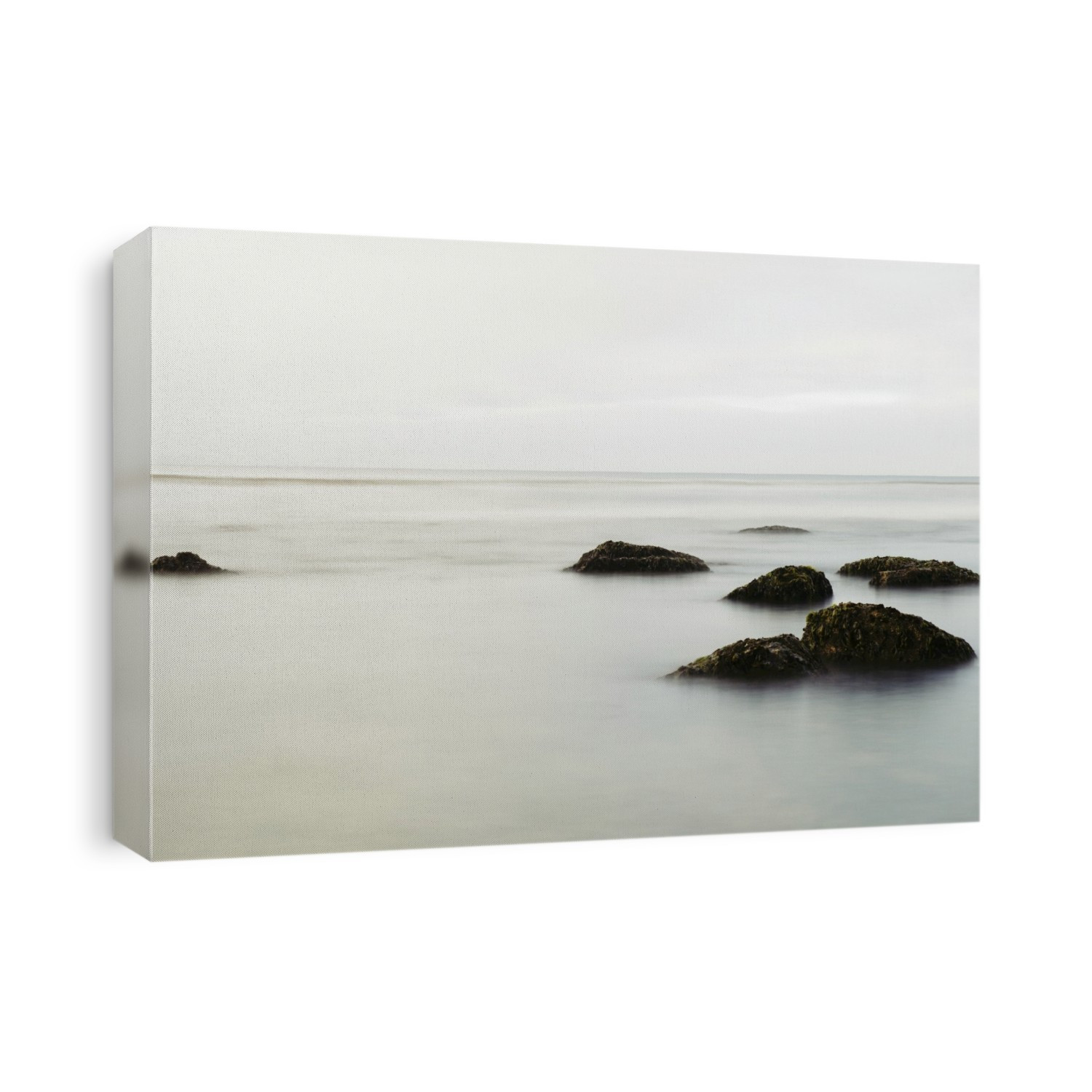 Long exposure ocean and rocks along the Central California coast, USA; Santa Cruz, California, United States of America