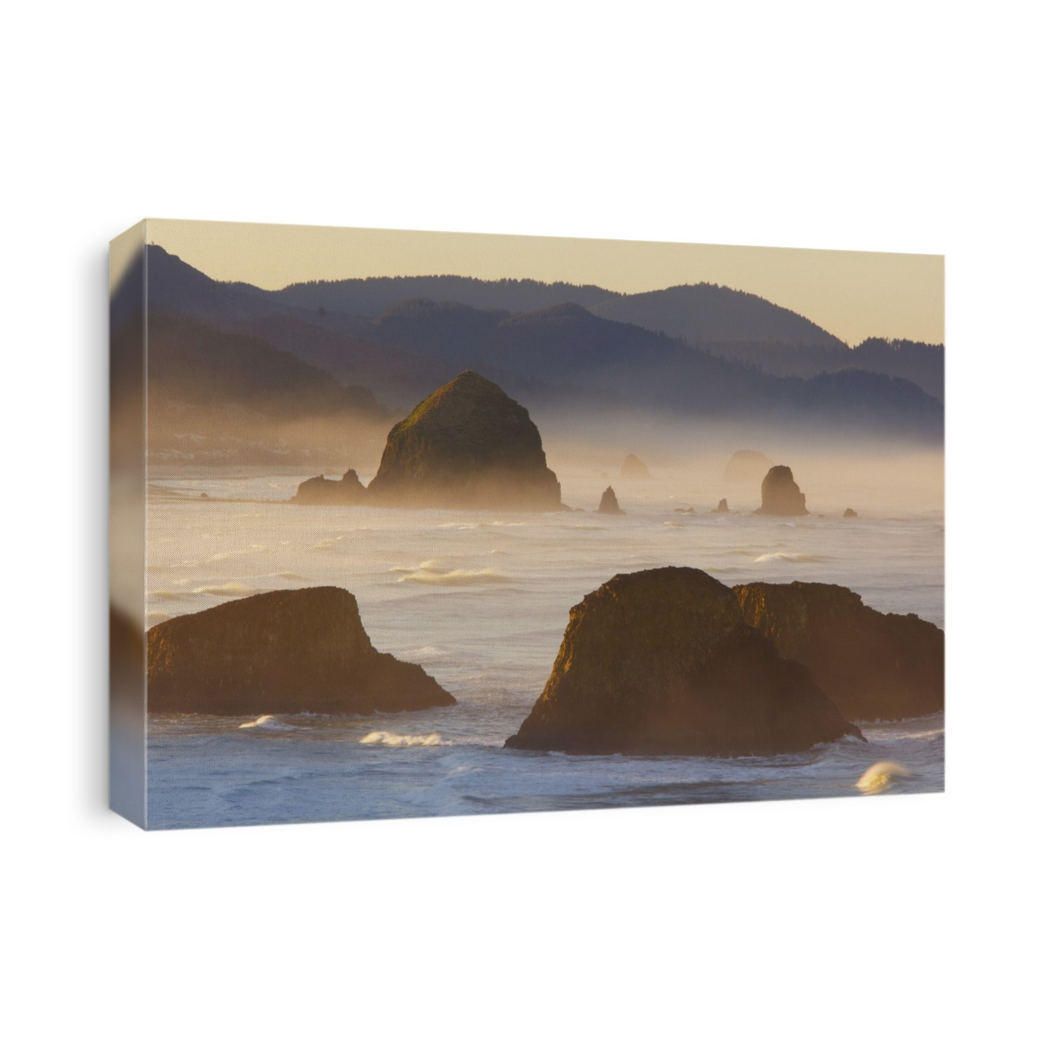Sunrise and morning fog add beauty to Cannon Beach and Haystack Rock from Ecola State Park; Oregon, United States of America