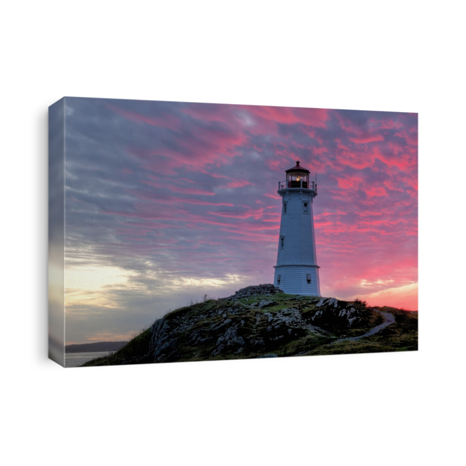 Louisbourg Lighthouse, Nova Scotia, Canada at sunset.
