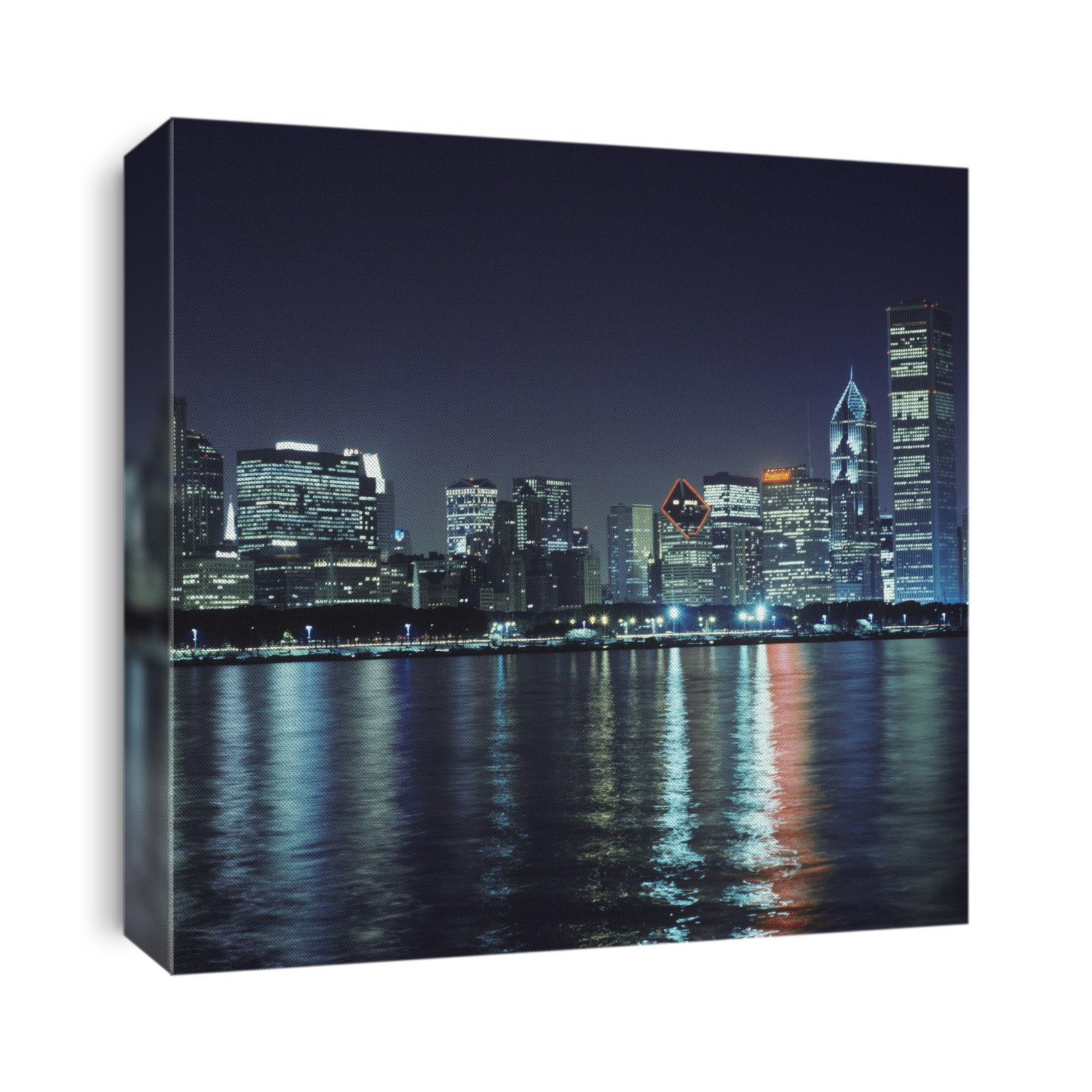 Chicago skyline at night. Chicago is the largest city of Illinois and the third largest in the USA. It is a major port and the commerical, financial, industrial and cultural centre of the Middle West.