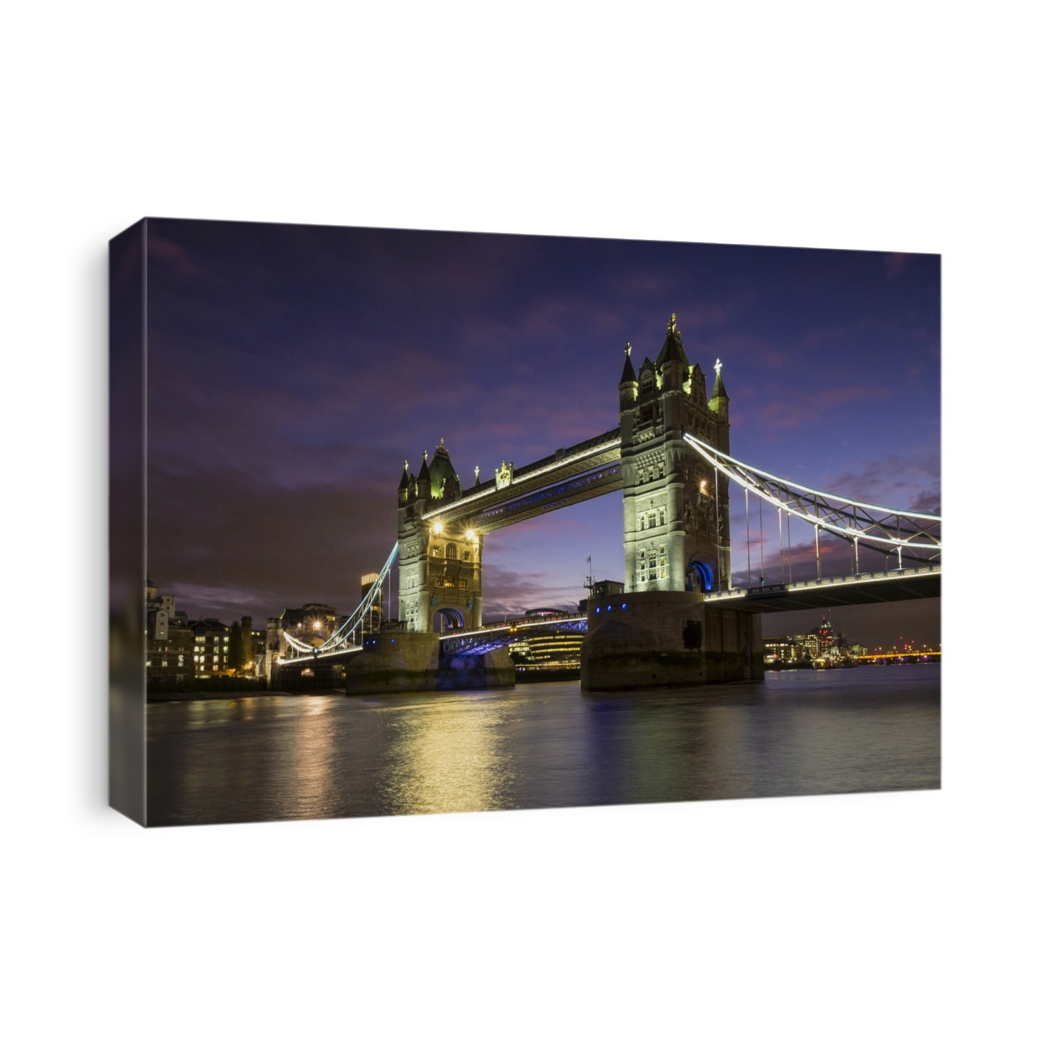 Tower Bridge illuminated at sunset.