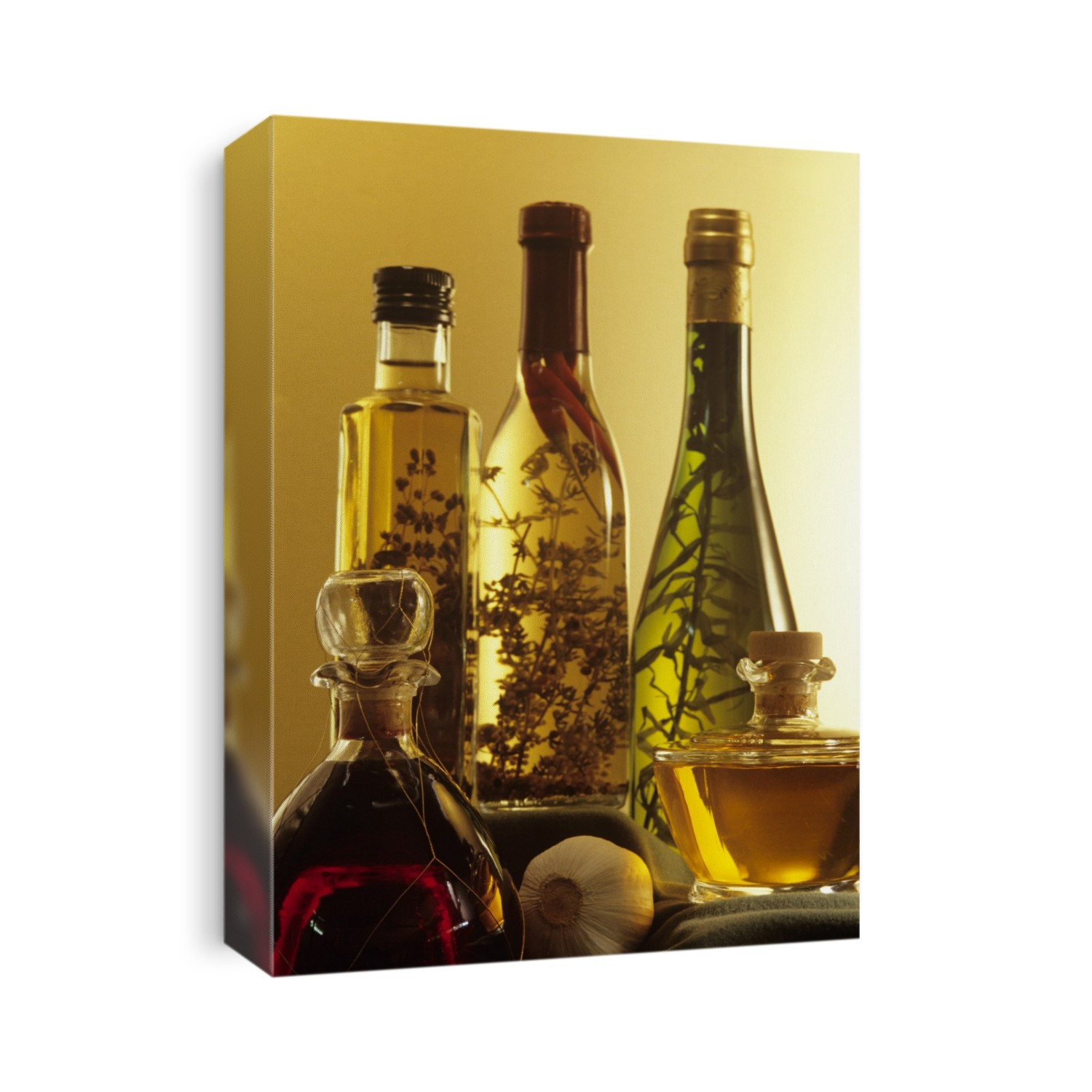 Salad dressings. Bottles of vinegar containing aromatic herbs and spices with olive oil.