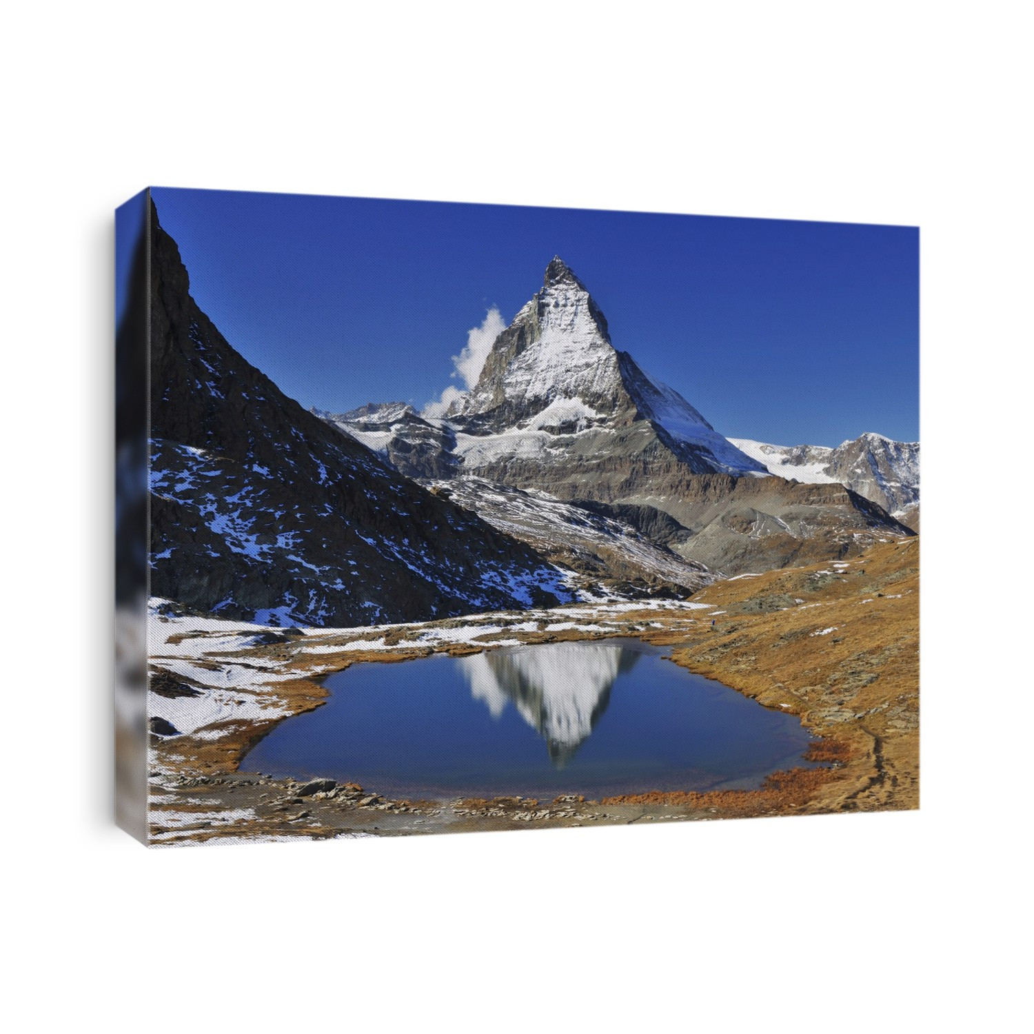 Matterhorn reflected in Lake Riffelsee, Zermatt, Alps, Valais, Switzerland