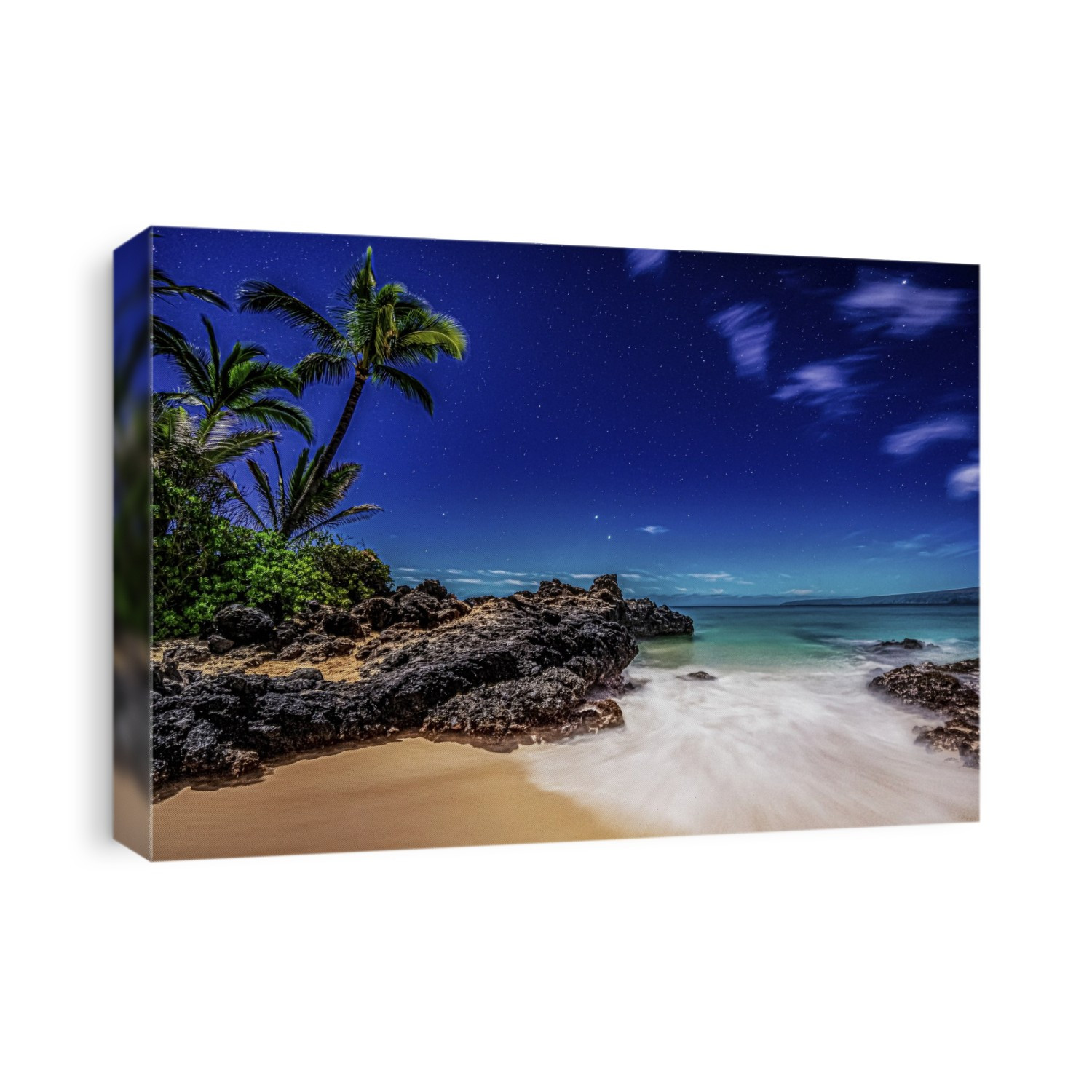 Starry skies viewed from a beach with palm trees and surf rolling into golden sand at Makena Cove on the island of Maui, Hawaii, USA; Maui, Hawaii, United States of America