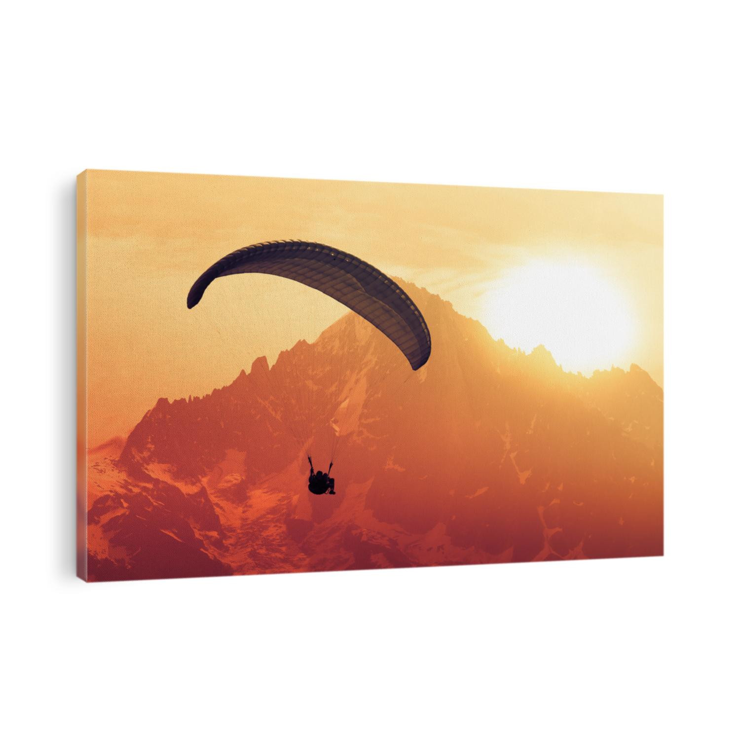 Sepia paraglide silhouette over Alps peaks