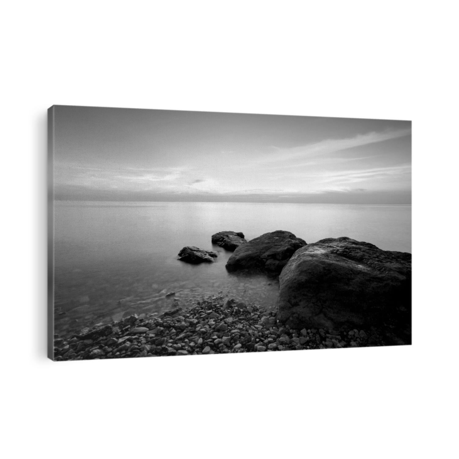 Long exposure photo of beach in the evening, black and white