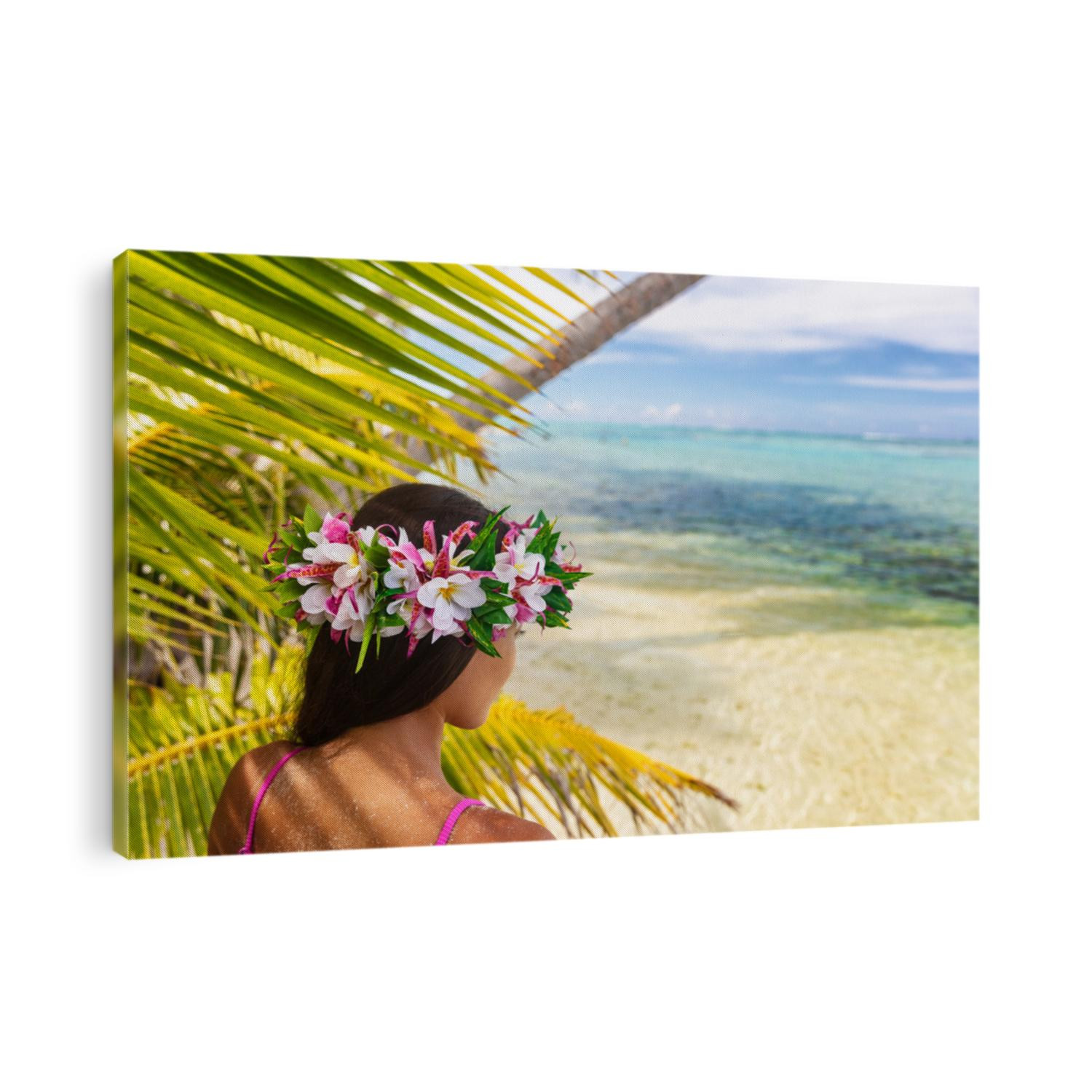 Hawaii beach woman luau dancer relaxing wearing wreath of fresh flowers on Tahiti Bora Bora, French Polynesia.