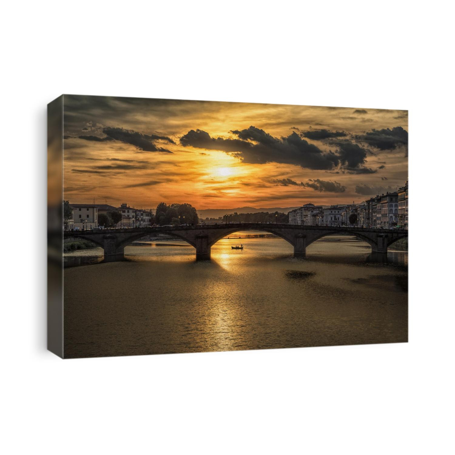 Bridge over the Arno River at sunset in Florence, Italy