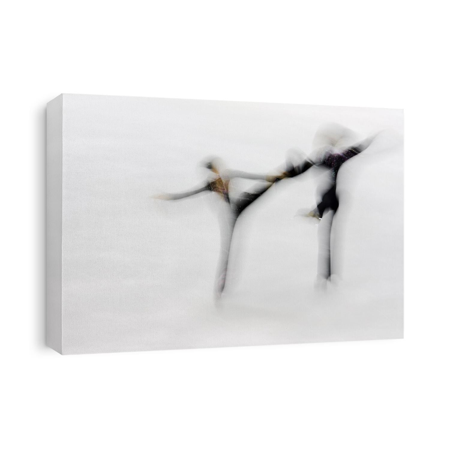 Blurred action of pairs figure skaters.