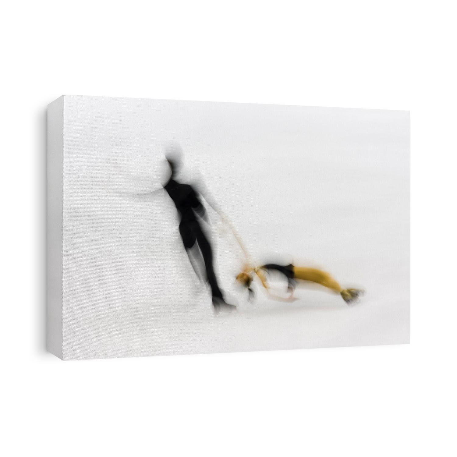 Blurred action of pairs figure skaters.