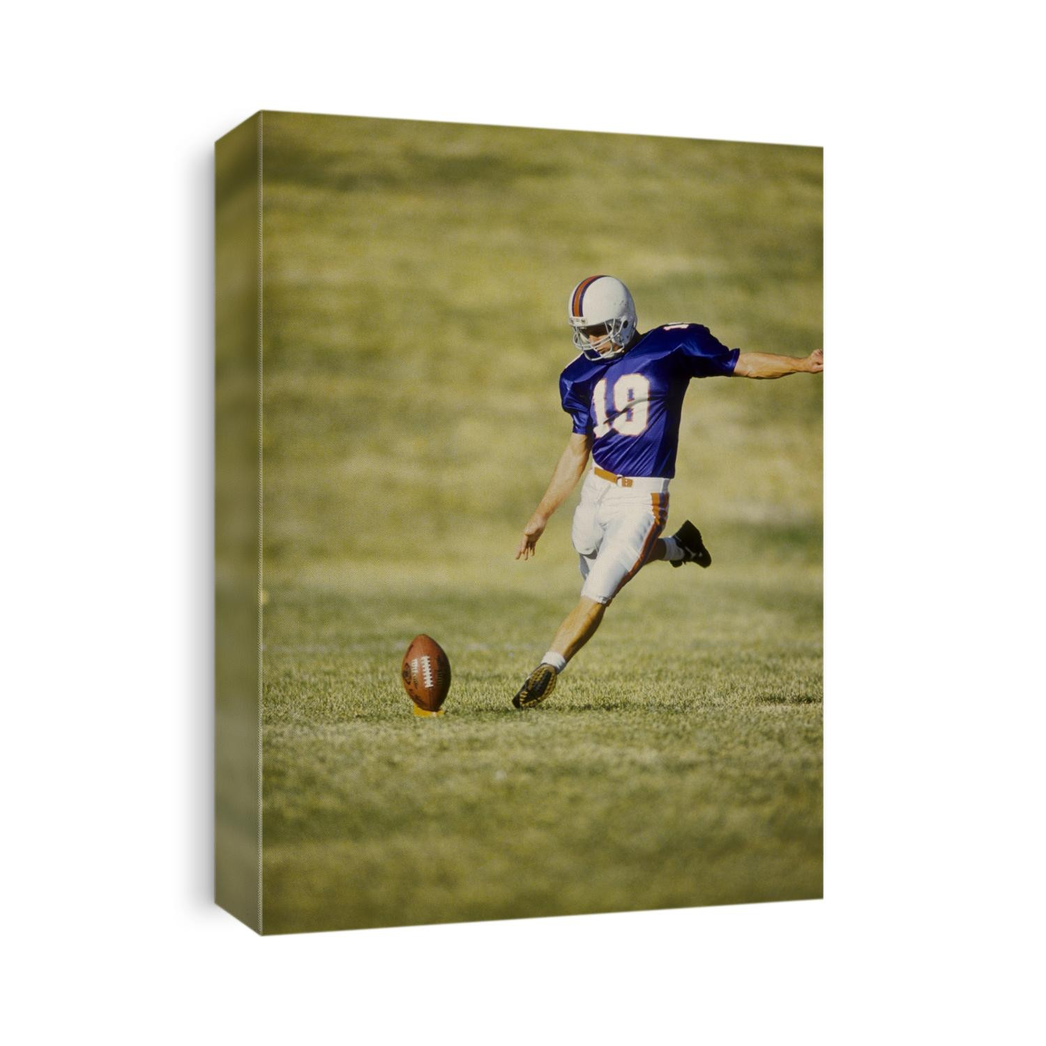 Football player kicking the ball.