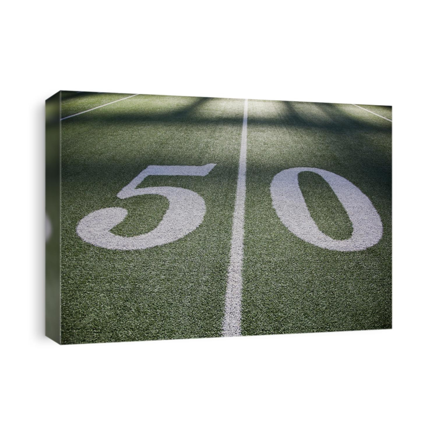 50 yard line marker in American Football stadium.