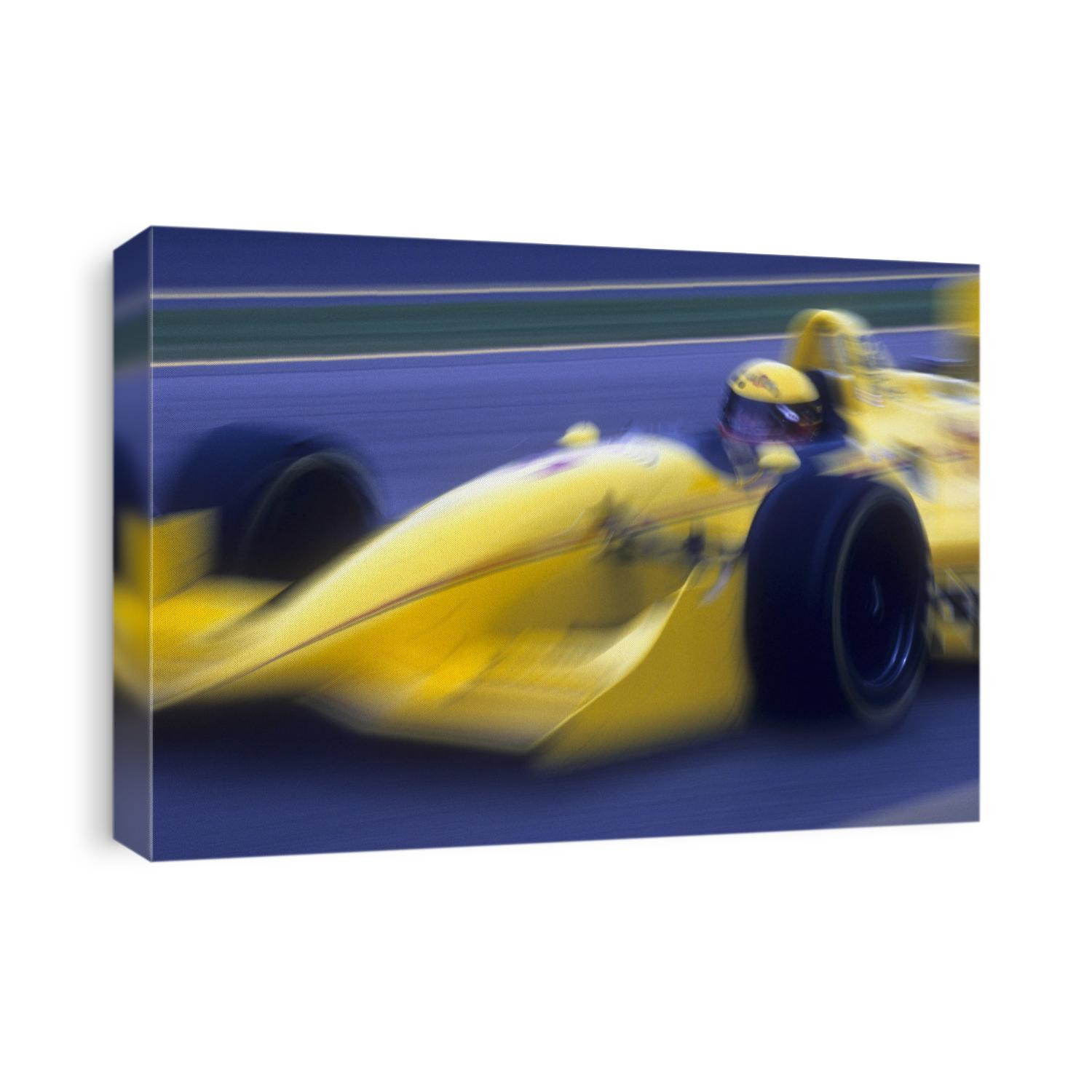 Blurred auto racing action.