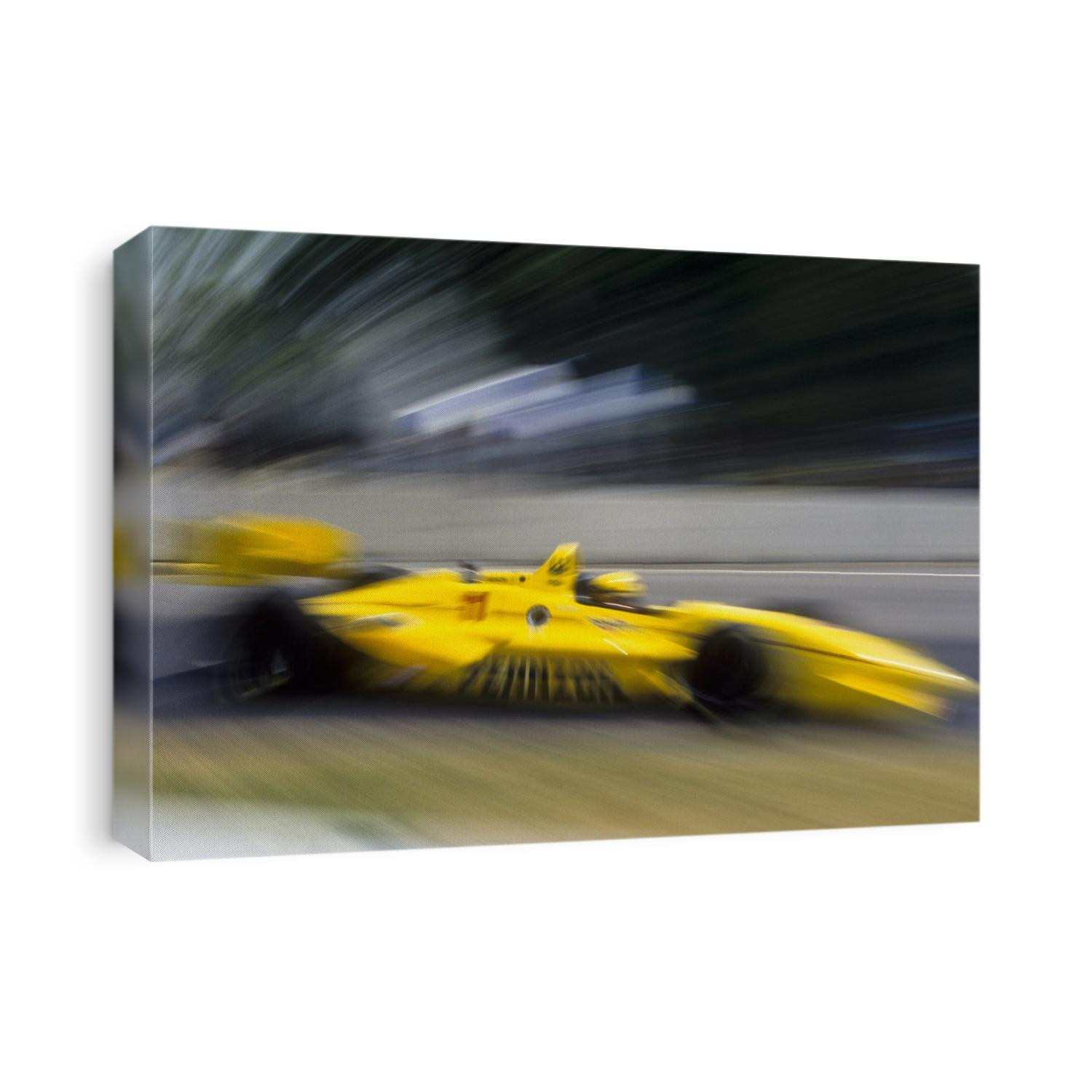 Blurred auto racing action.