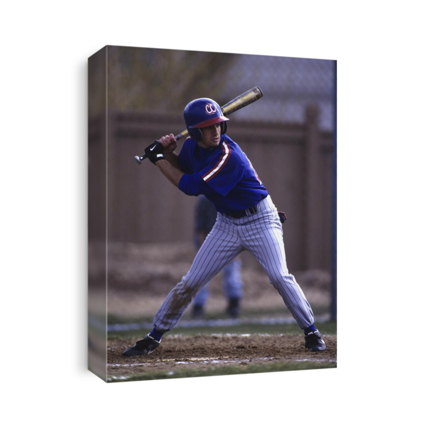 Baseball player in action batting.