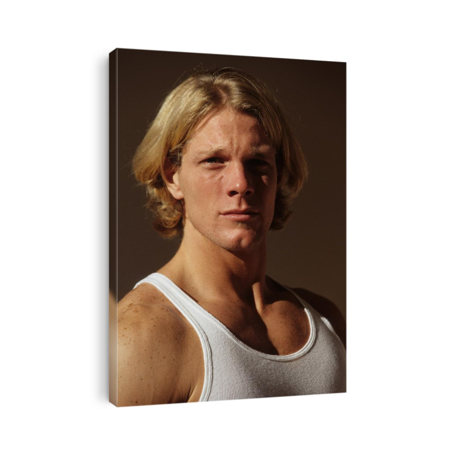 Portrait of young man in fitness studio.