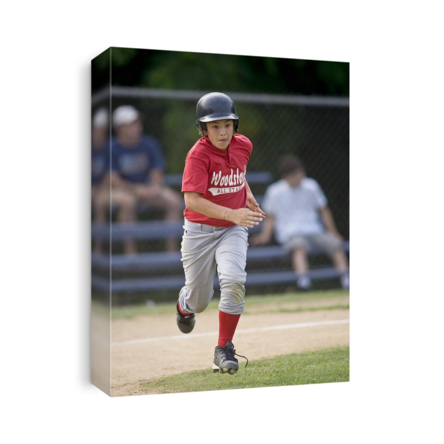 Boys baseball game action.