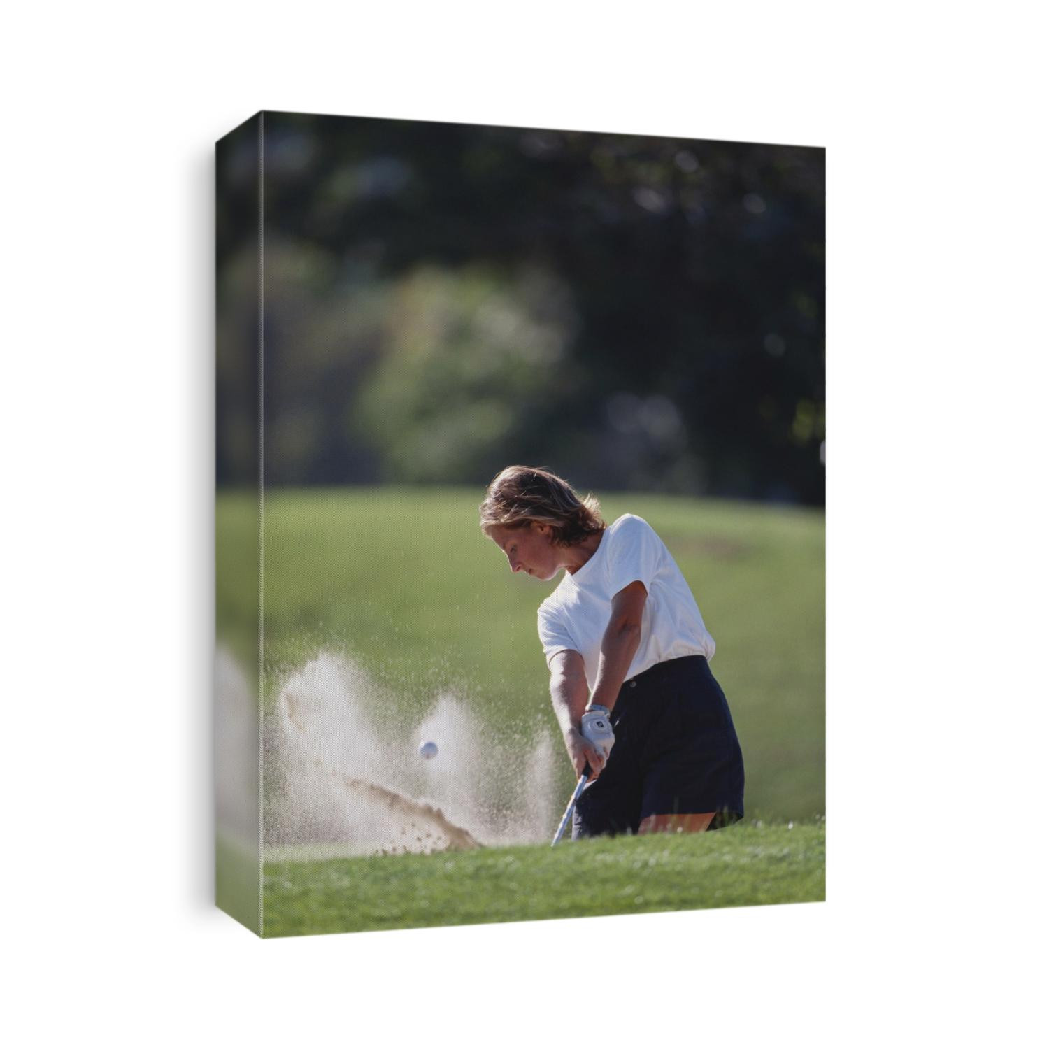 Woman golfer in action.