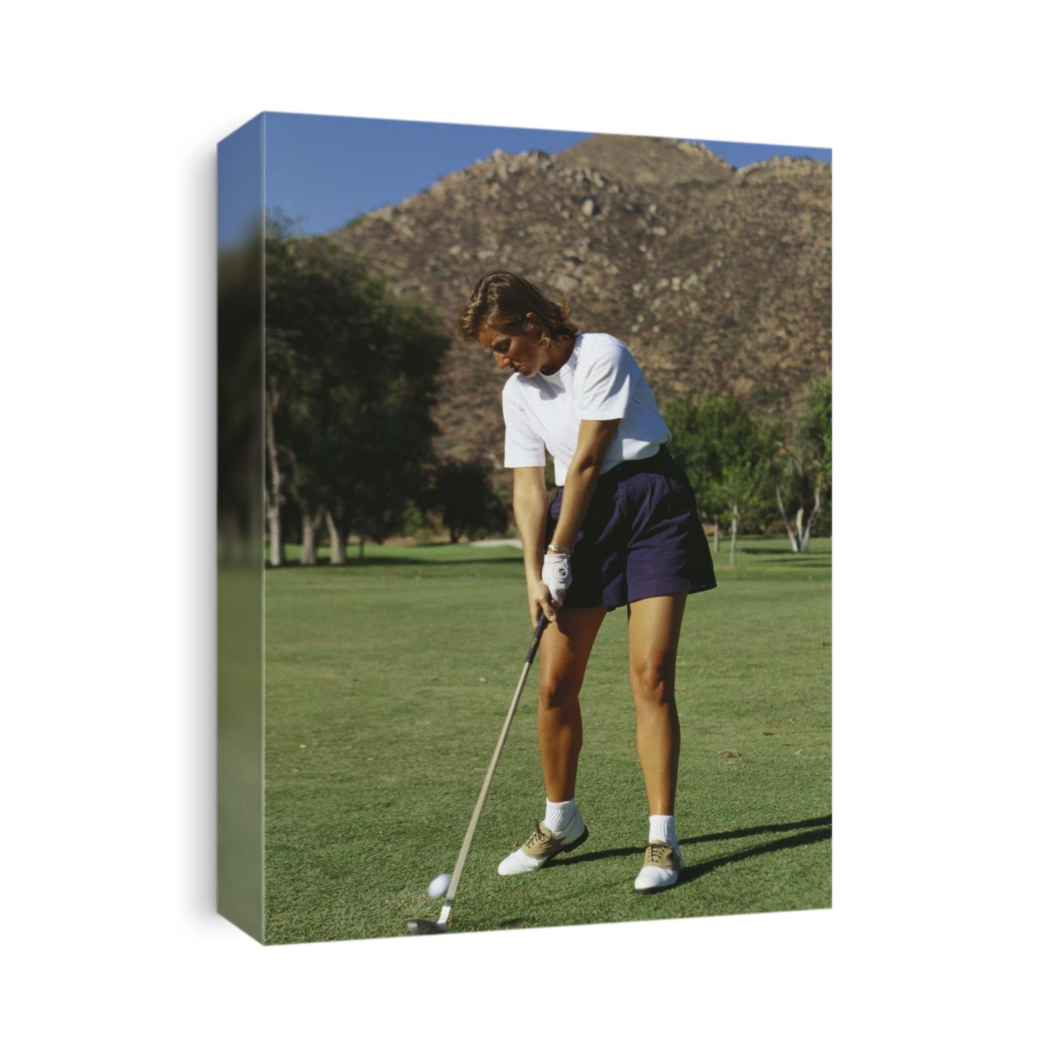 Woman golfer in action.