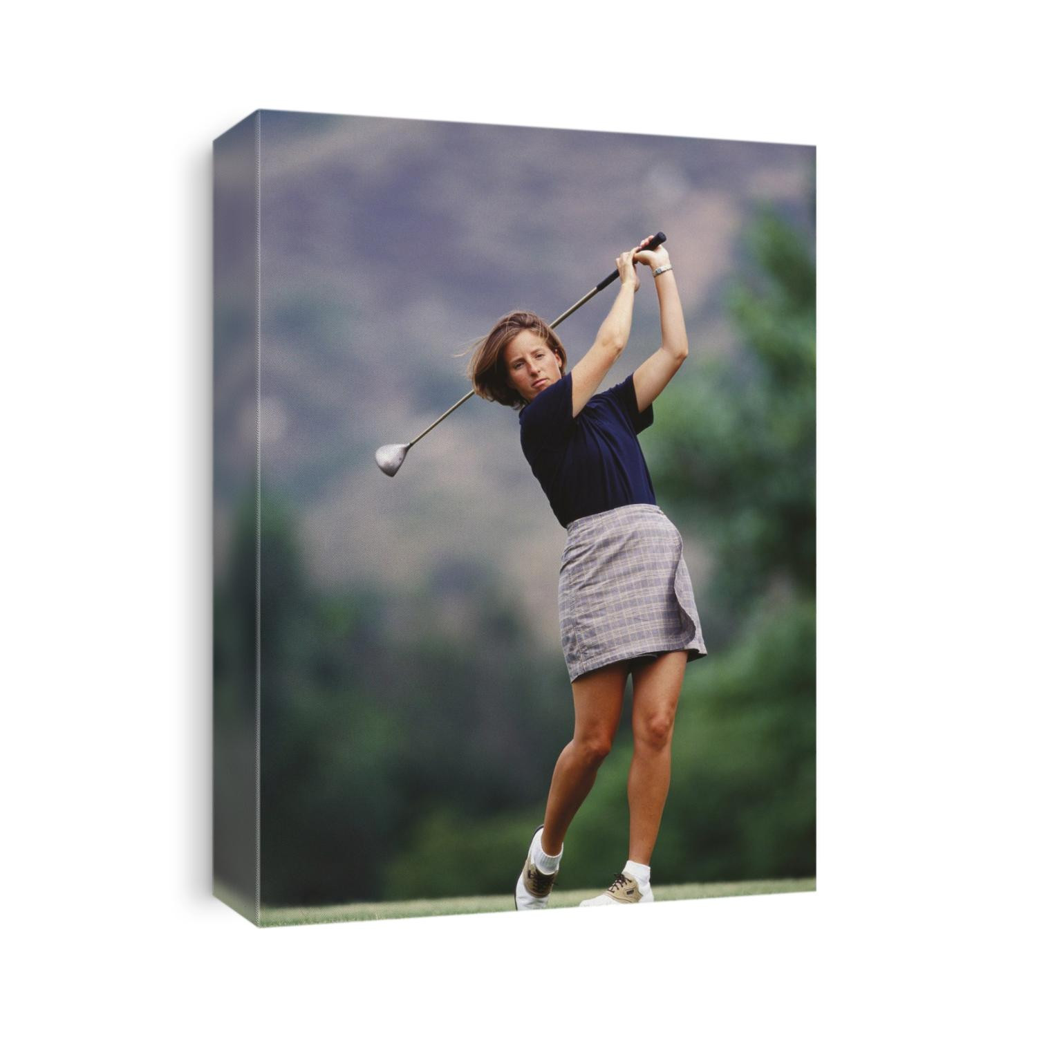 Woman golfer in action.