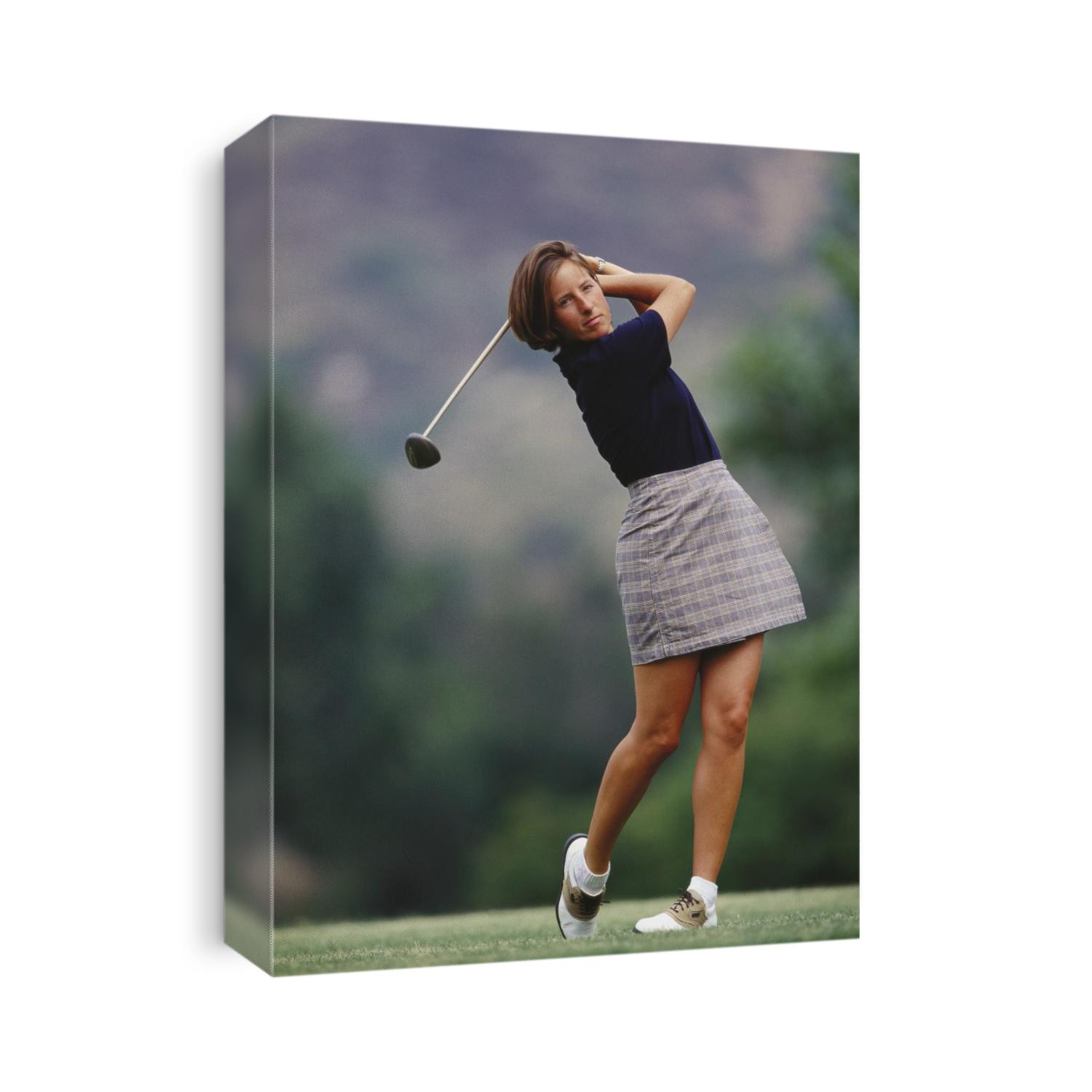 Woman golfer in action.