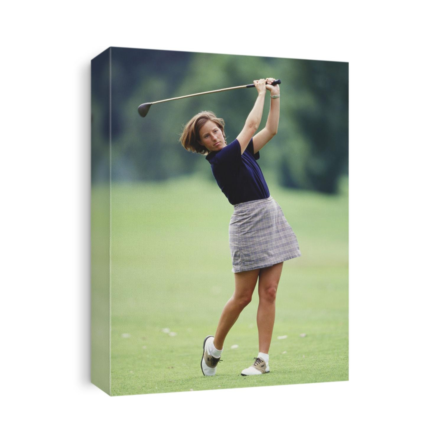 Woman golfer in action.