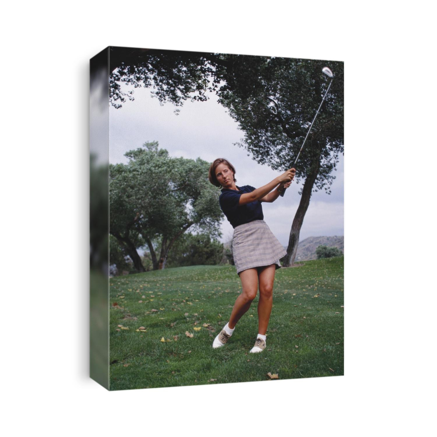 Woman golfer in action.