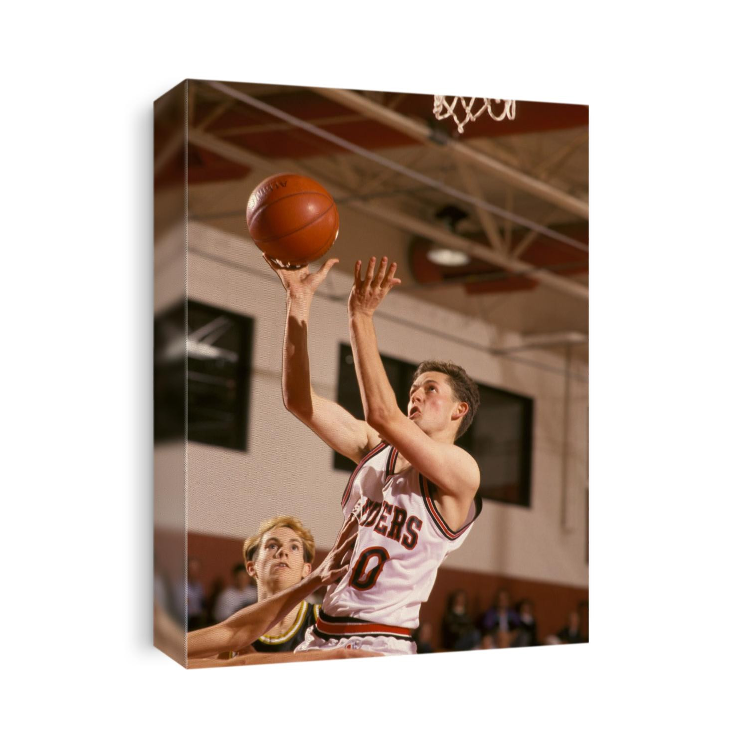 High school boys basketball player shooting.