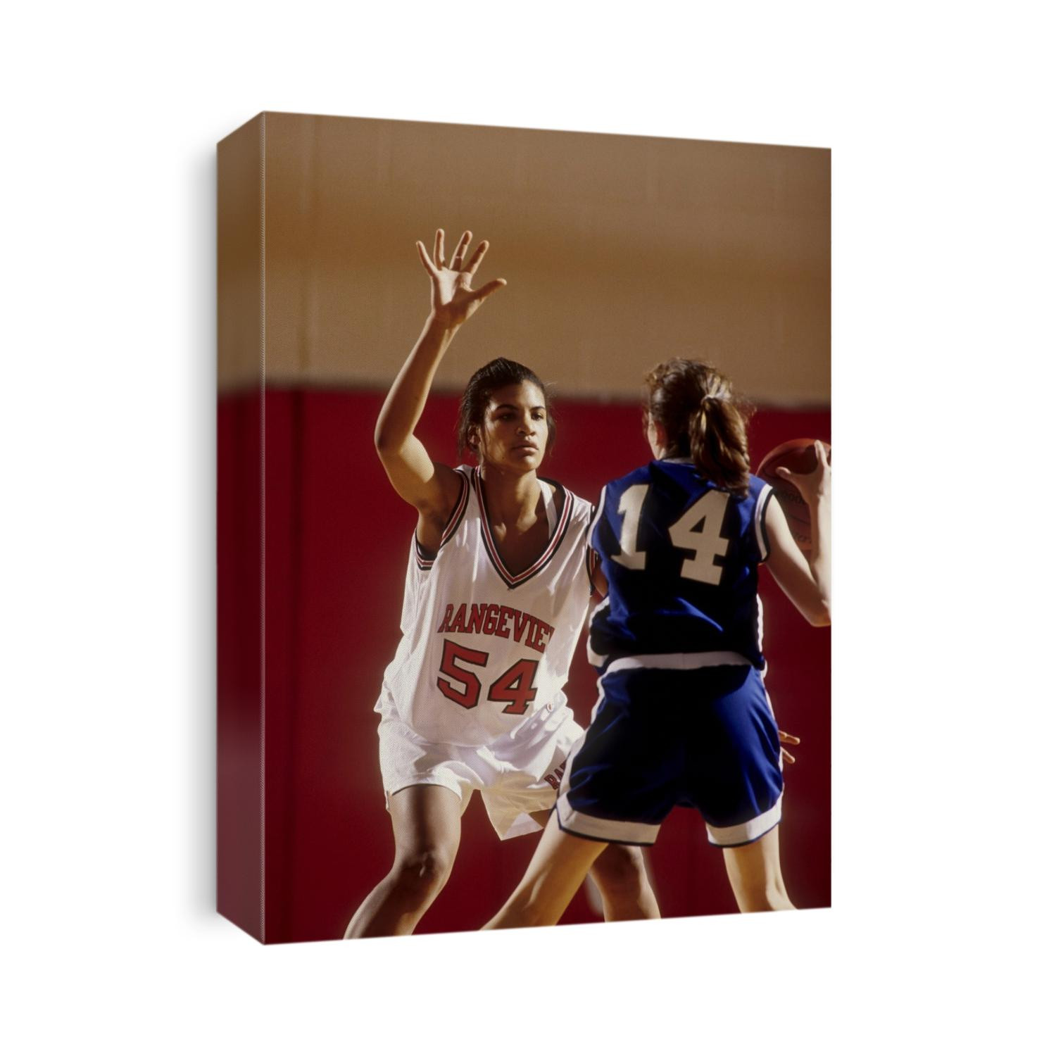 Girls High School basketball player during a game.