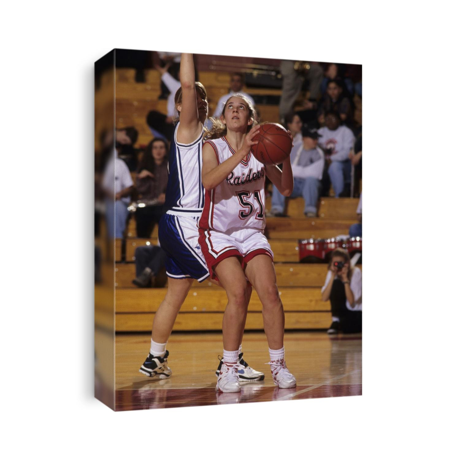 High School Girls basketball players in action during a game.